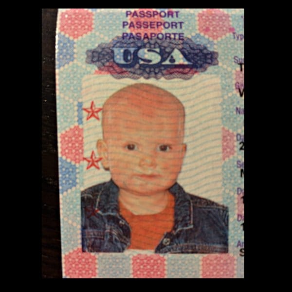 Not a 1950s gangster, my cute boy's first passport photo.